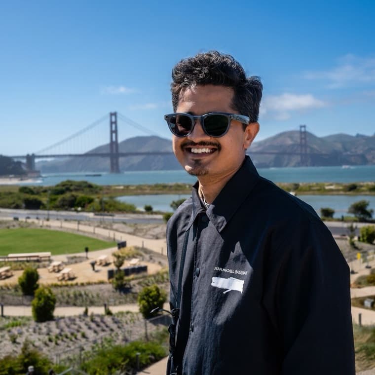 Saurabh Kakade in San Francisco, the Golden Gate Bridge behind him.